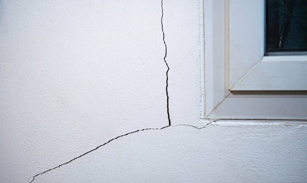 Cracks On The Wall. The Crack In The Cement Wall At The Window S