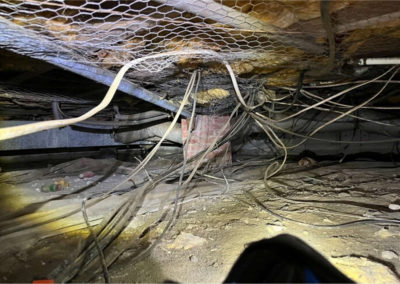 Image of unsealed crawlspace vents causing moisture issues in Mike Gibbens' home