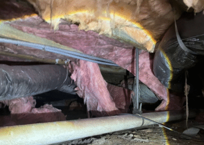 Damaged Crawl Space Insulation And Exposed Ductwork