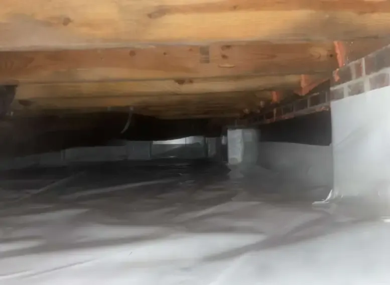 crawl space repair completed with moisture barrier installation